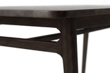 Prescott dining table close-up of the corner, tapered leg and stretcher