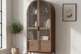 Prescott brown arched cabinet in a bright room beside an olive tree