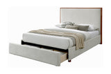 Quinn Queen platform bed in oat fabric with bedding, three-quarter view, drawer open