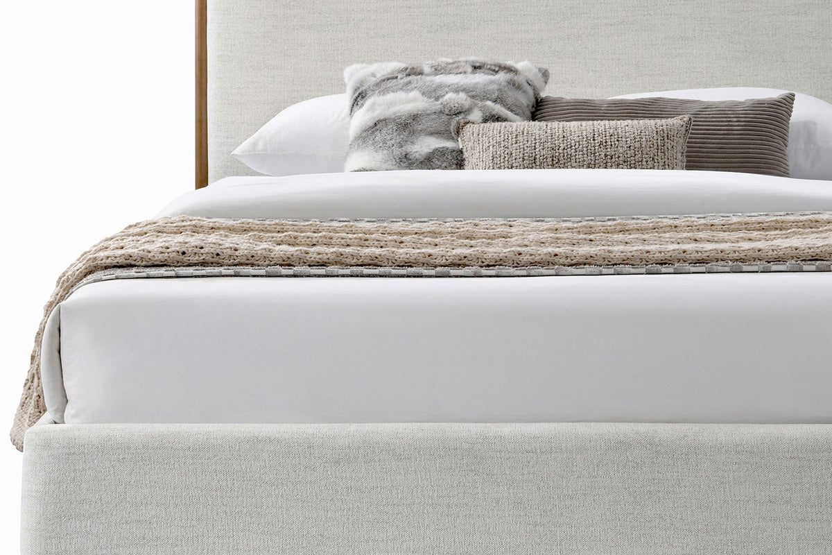 Quinn King platform bed in oat fabric, close view of padded rails and headboard