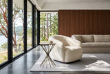 Rango side table beside an ivory shearling chair in a Cowichan Bay house, with walnut panelling
