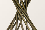 Close-up of the Rango base: faceted metal rods in an antique brass finish crossing at the pinched waist
