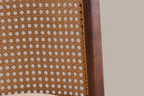 Close-up of the Rasiglia cane-look back panel with its golden edge strip, the walnut frame and the beige seat