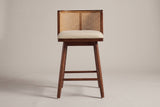 Rasiglia counter stool, straight front view: low wrap-around cane-look back with a centre strip, beige seat