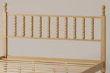 Close-up of the Ravenna headboard: ten turned bobbin spindles between two posts with ball finials