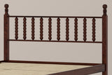 Close-up of the Ravenna headboard in Walnut: ten turned bobbin spindles between two posts with ball finials