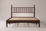 Ravenna spindle bed in Walnut, straight front view on a studio backdrop