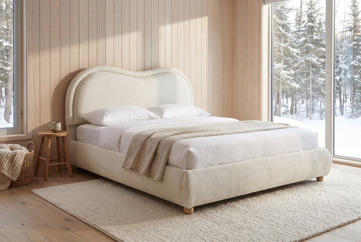 Recanati cloud bed in a cedar-clad cabin bedroom with snowy spruce forest through a tall window