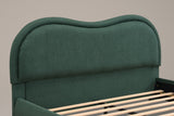 Close-up of the Recanati headboard in forest green chenille: the wavy top