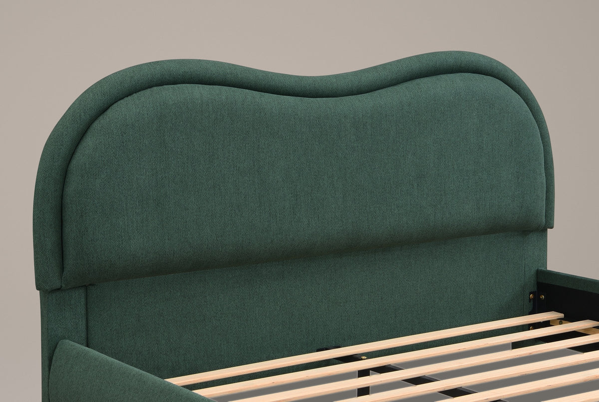 Close-up of the Recanati headboard in forest green chenille: the wavy top