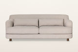Ripatransone sofa in Beige, straight front view on a warm white studio backdrop: two seat cushions on a rounded base
