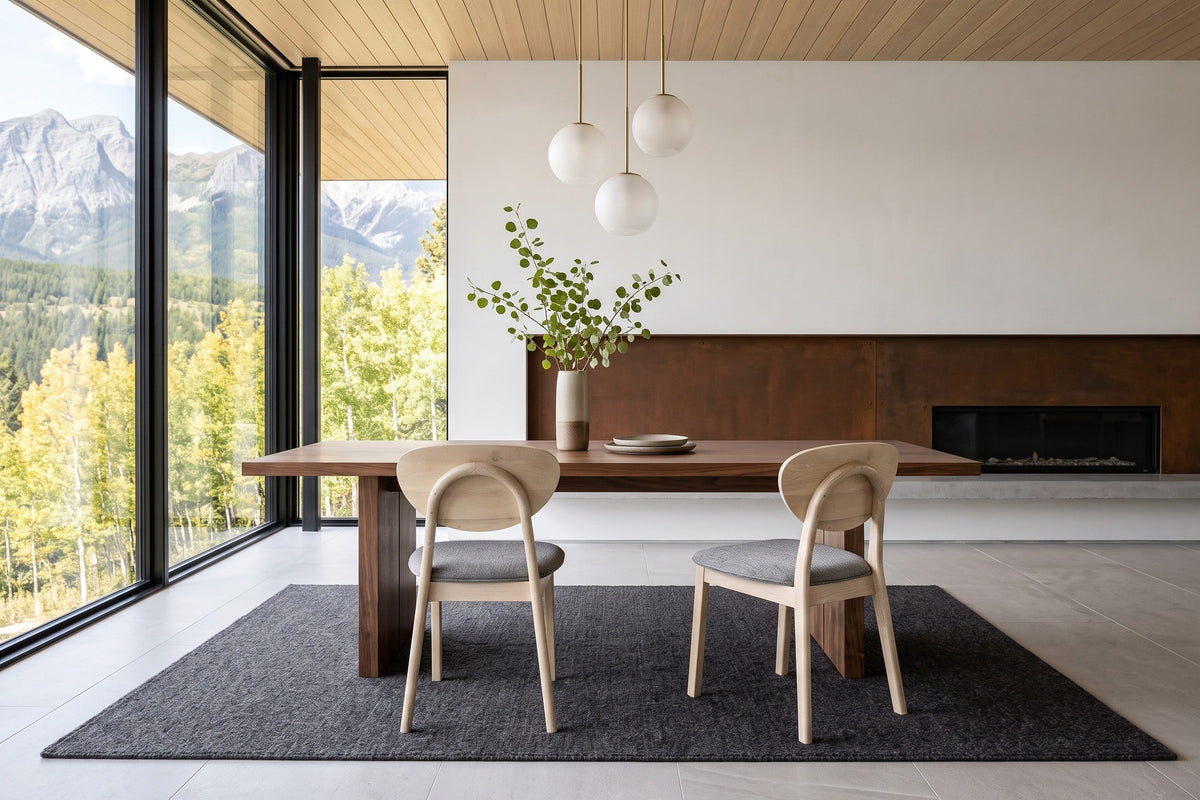Two Rivello dining chairs seen from behind at a walnut table in a Radium Hot Springs house