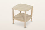 Rivello oak side table in Light Oak, three-quarter view from above on a warm white studio backdrop: a soft square top