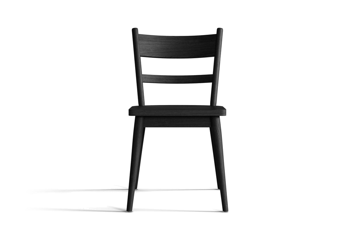 Rocco ladder-back dining chair in wire-brushed, ebonized black oak on a white background