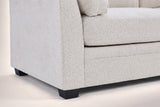 Close-up of the arm front, the base seam and two black tapered legs
