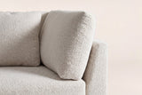 Close-up of the beige chenille arm pillow, the seat cushion and the square top of the flared arm