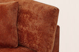 Close-up of the caramel chenille arm pillow, a square pillow, the seat cushion and the square top of the flared arm