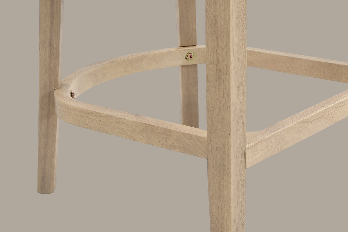 Close-up of the D-shaped wooden footrest of the Natural Ash Sabaudia counter stool with its exposed brass-tone hex bolts