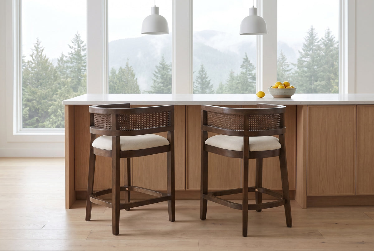 Two Sabaudia counter stools in Walnut pulled out from a white-oak kitchen island in a Vancouver townhouse in morning light