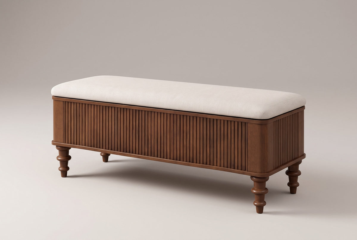 Salerno reeded storage bench in walnut with an ivory linen-look seat, three-quarter view on a warm grey studio backdrop