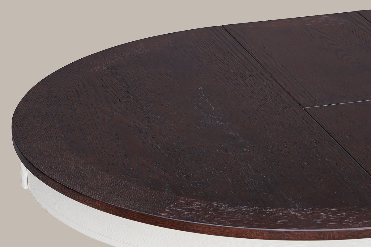 Close-up of the Saluzzo oak-veneer top: cross-grain border segments, the seam and the distressed white apron