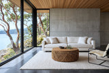 Sambuca coffee table in a Mayne Island house, with board-formed concrete, a cedar slat ceiling