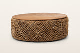 Sambuca round coffee table in Natural, front view on a warm white studio backdrop: a thin reclaimed teak top on a low drum