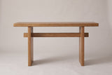 Sanremo console table in antique brown, straight front view: a thick top, two slab legs and one stretcher through both