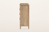 Side view of the Sarnano chest in Sand on a warm white studio backdrop: a flat oak side panel between two round posts that en