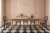 Sarnano dining table in Sand in a Toronto townhouse with dusty-rose walls