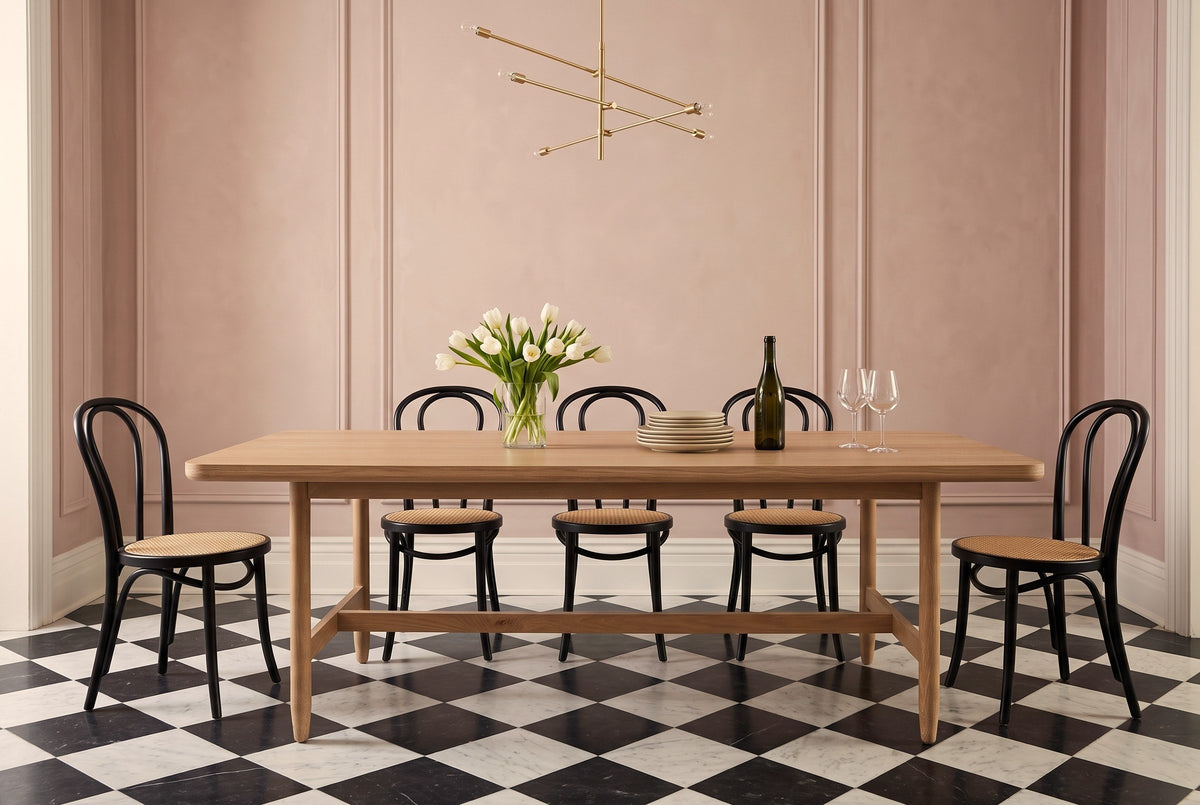 Sarnano dining table in Sand in a Toronto townhouse with dusty-rose walls
