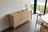 Sarnano sideboard in Sand seen from above at an angle against board-formed concrete in an Austin hillside house