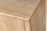 Close-up of a corner of the Sarnano sideboard in Sand: the softly rounded top edge above a round corner post and the oak grai