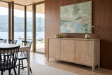 Sarnano sideboard in Sand against walnut panelling in a Shuswap lake house, with a fir ceiling, abstract art