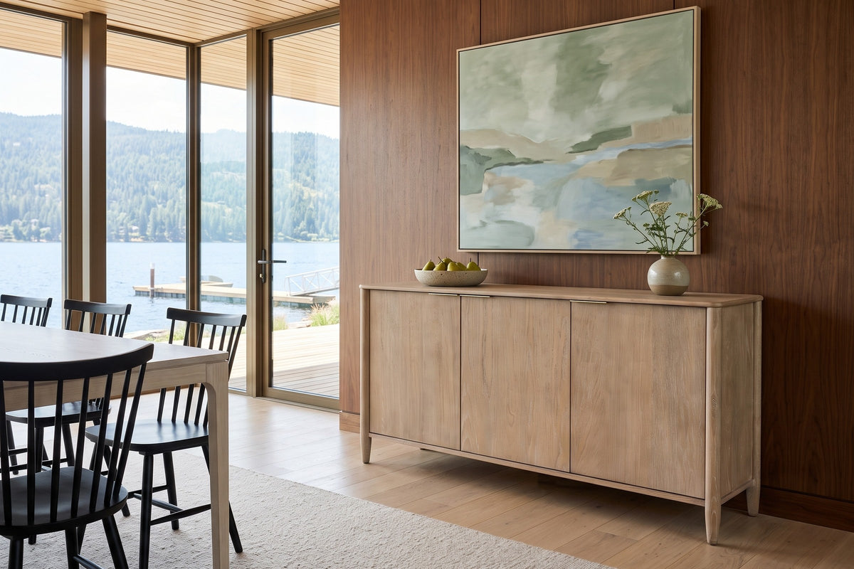 Sarnano sideboard in Sand against walnut panelling in a Shuswap lake house, with a fir ceiling, abstract art