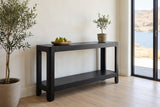 Sarnico console table in the bright entry of a lake house, pears in a wooden bowl and a small olive tree on top