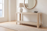 Sarnico console table in natural in a white front hall above the harbour, a lamp and a stone bowl on top