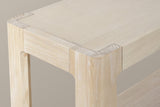 Close-up of a top corner in the natural finish: the framed wood veneer top