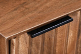 Close-up of the Sarteano top edge in Pecan mango and the slim black metal tab pull over the carved flutes