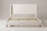 Sarzana wingback bed in ivory chenille, straight front view on a studio backdrop