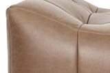 Close-up of a Sassocorvaro corner in Antique Sienna: a raised roll meeting the dip, puffed leather and double stitching