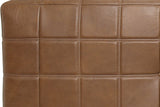 Close-up of the Sassocorvaro leather in Antique Sienna: padded squares with double light-tan top-stitching