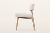 Savoca dining chair in Porcelain Chenille, side view on a warm white studio backdrop