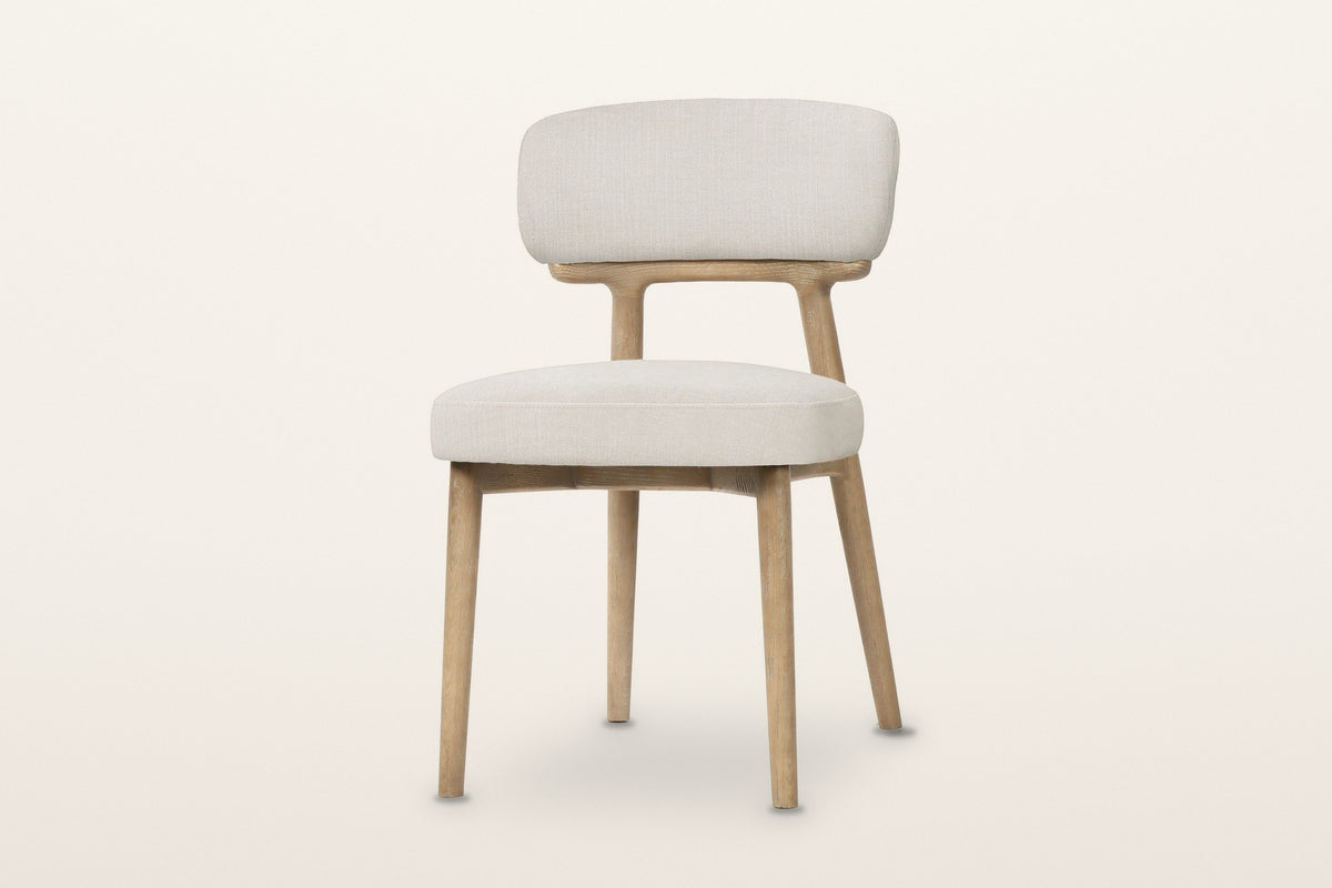 Savoca dining chair in Porcelain Chenille, three-quarter view on a warm white studio backdrop
