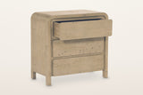 Scheggino chest in Brown with the top drawer pulled out on a warm white studio backdrop