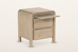 Scheggino nightstand on a warm white studio backdrop with its slim tray pulled out above the two drawers
