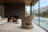 Sefro accent chair in Chocolate in a Whitehorse river house, by a corten steel fireplace wall
