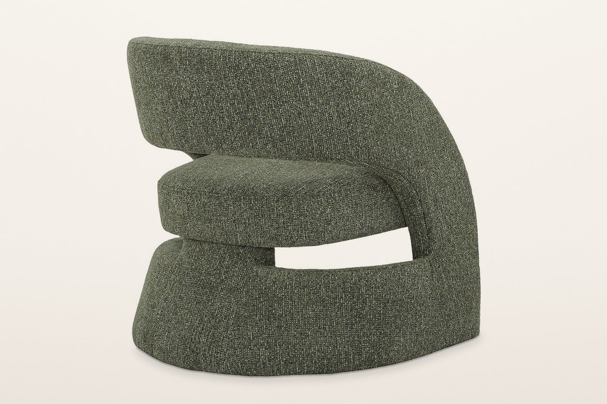 Sefro accent chair in Green from the rear three-quarter on a warm white studio backdrop: the outside of the back band over th