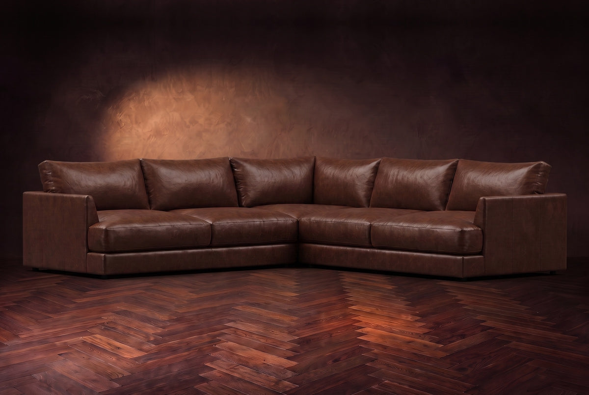 Serena corner sectional in Burnished Chestnut on a walnut herringbone floor, three-quarter view.