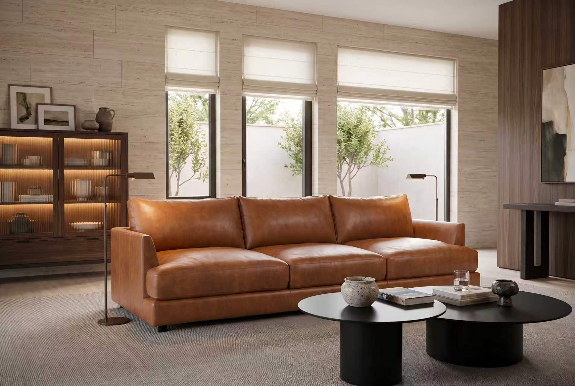 Serena three-seat leather sofa in Cognac in a bright living room
